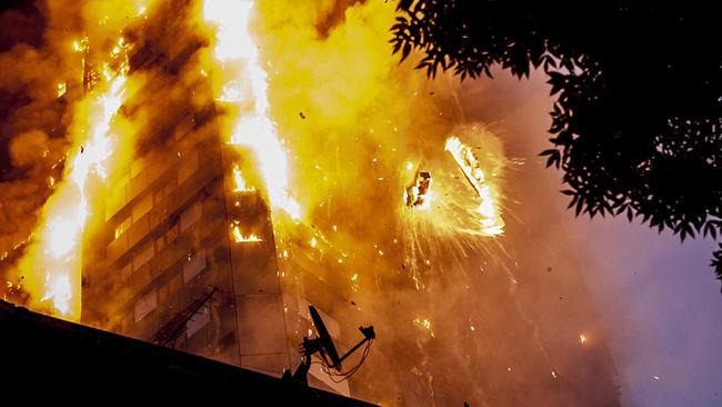 The fire takes off in the 24-storey apartment block yesterday. Picture: Guilhem Baker/LNP