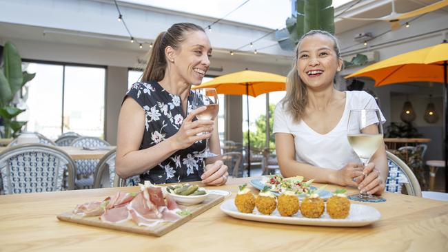 Eliza Dorner and Doris Nguyen enjoy the open air bar at The Shelbourne Hotel. Picture: Justin Lloyd