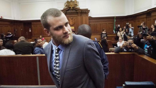 Van Breda is handcuffed and led out of court after being sentenced. Picture: AFP/Rodger Bosch