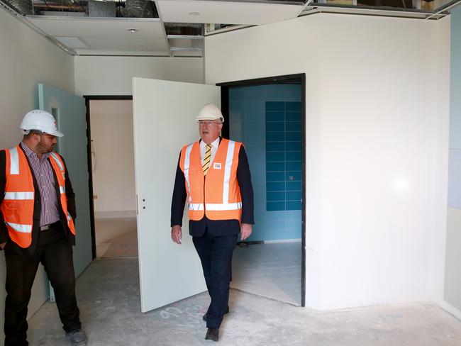 An ensuite bathroom in one of the paediatric rooms. Minister for Health Brad Hazzard takes a peek. Picture: Damian Shaw.