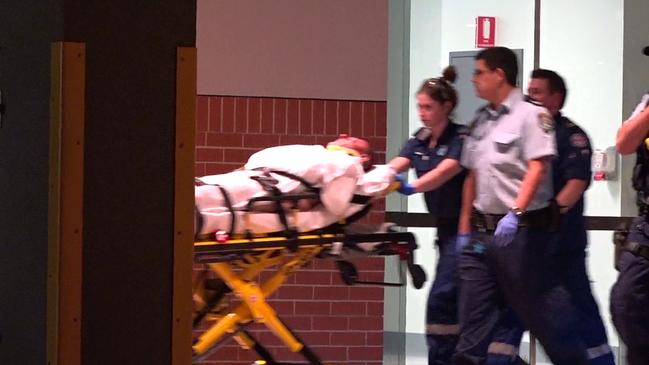 Nicola “Nick” Gilio, stabbed by the alleged attacker, is taken to a waiting ambulance. Picture: TVN