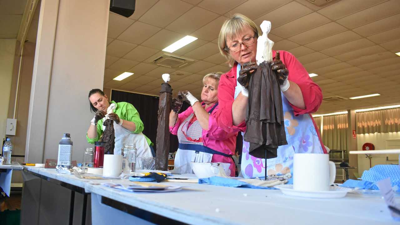 Fiona Moore, Larissa Jackson and Roslyn Ware working on garden sculptures at Injune's Creative Odyssey. Picture: Jorja McDonnell