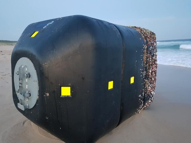 The buoy, about the size of a car, washed up on the beach at The Entrance North.