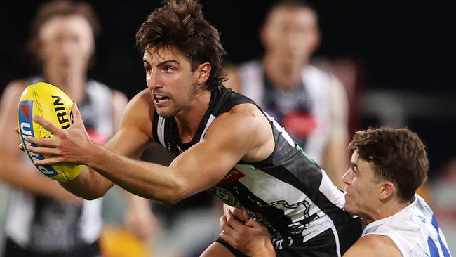 AFL Round 13. Collingwood vs North Melbourne at the Gabba, Brisbane..24/08/2020...  Josh Daicos of the Magpies stands up in the tackle of Thomas Murphy of the Kangaroos   . Pic: Michael Klein