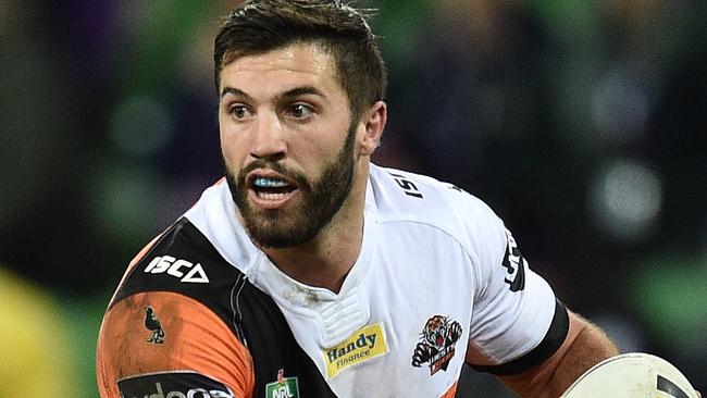 James Tedesco of the Tigers holds the ball during the Round 16 NRL match between the Melbourne Storm and the Wests Tigers at AAMI Park in Melbourne, Sunday, June 26, 2016. (AAP Image/Julian Smith) NO ARCHIVING, EDITORIAL USE ONLY