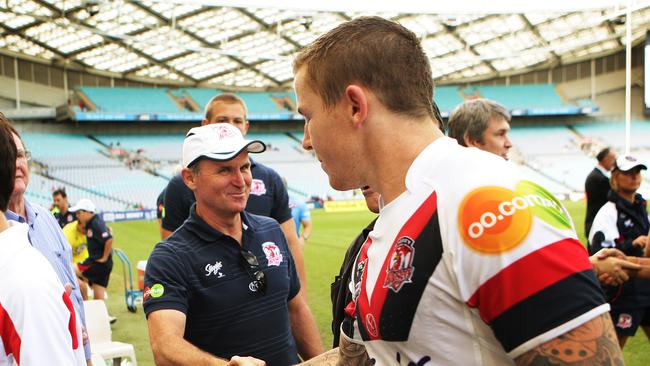 A happy Roosters coach Brian Smith congratulates Todd Carney after a win.