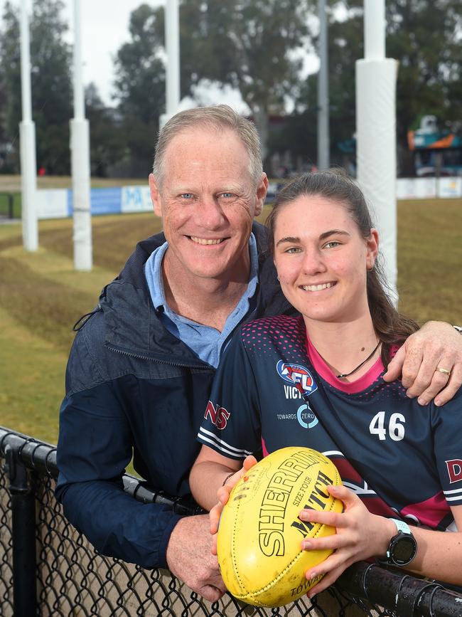 Nathan with his daughter Alice, 16, who wants to wear her dad’s famous number 3 for St Kilda in the AFLW. Picture: Josie Hayden