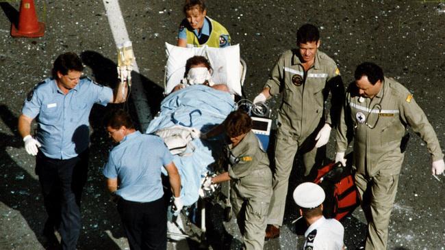 Peter Wallis is carried out of National Crime Authority building in Waymouth Street after the explosion in 1994.