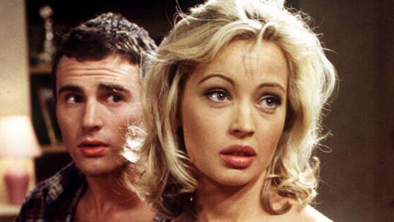 Kimberley Davies in 'Neighbours' wearing nothing but a sheet in 1996. Picture: Supplied