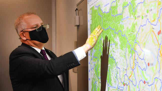 Prime Minister Scott Morrison visits the Local Disaster Coordination Centre in Brisbane City Council for an update on the floods situation in Queensland. Picture: NCA NewsWire / Dan Peled