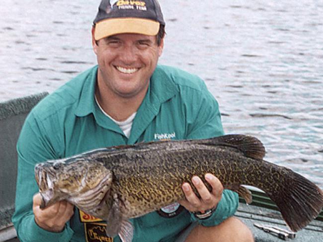 Mark Pertot form Davo's Bait and Tackle with a 5kg Mary River Cod he caught and released in Jan 2005  headshot smiling fish fishing .