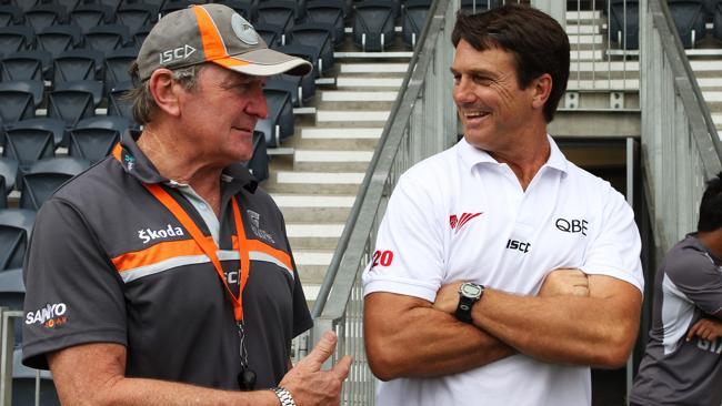  Former Swans coach Paul Roos speaks to the media with GWS Giants coach Kevin Sheedy. 