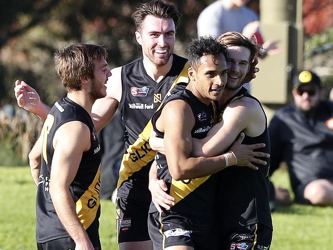 SANFL - Glenelg v North Adelaide at ACH Group Stadium. Marlon Motlop celebrates his goal with team mates. Picture SARAH REED