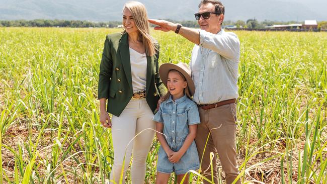 Three generations of the Straguszi family are behind the Cutter's Rise residential development near Gordonvale. Pictured are Cutter's Rise sales agent Renee Straguszi, her daughter Adriana, 7, and her father Ross Straguszi. Picture: supplied.