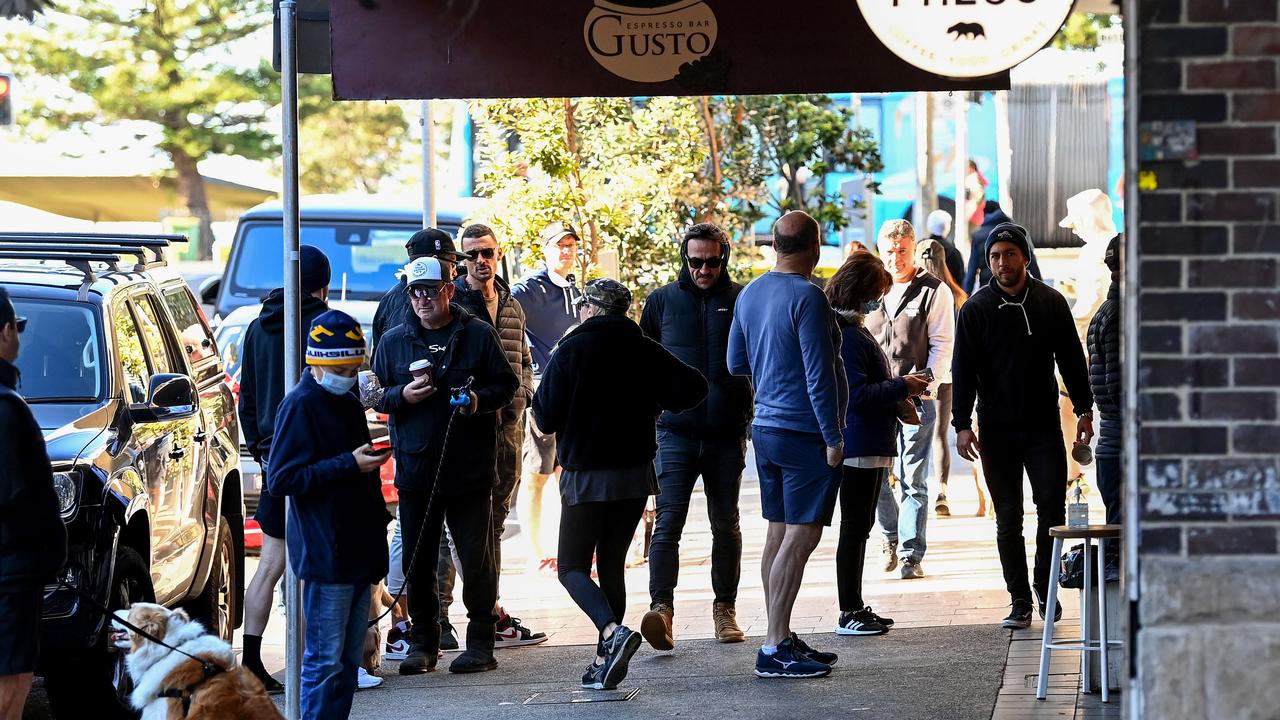 People gather as they wait to collect takeaway coffee and food at Bondi Beach, in Sydney. Picture: NCA NewsWire/Bianca De Marchi