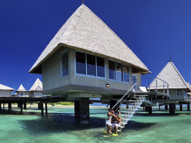 Overwater bungalows at L'Escapade Island Resort in New Caledonia.