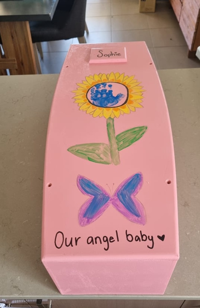 The handmade coffin, from Farewell Funerals in Meadowbrook, the family were able to decorate for Sophie. Picture: Supplied