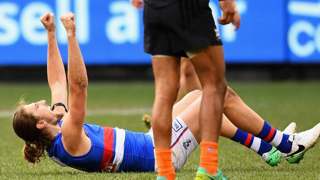 Marcus Bontempelli celebrates after kicking a goal.