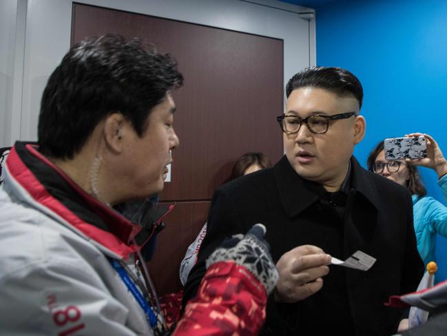 South Korean police check the ticket of a man impersonating North Korean leader Kim Jong Un after he was removed while appearing before North Korean cheerleaders attending the Unified Korean ice hockey game against Japan during the Pyeongchang 2018 Winter Olympic Games at the Kwandong Hockey Centre in Gangneung on February 14, 2018. Picture AFP