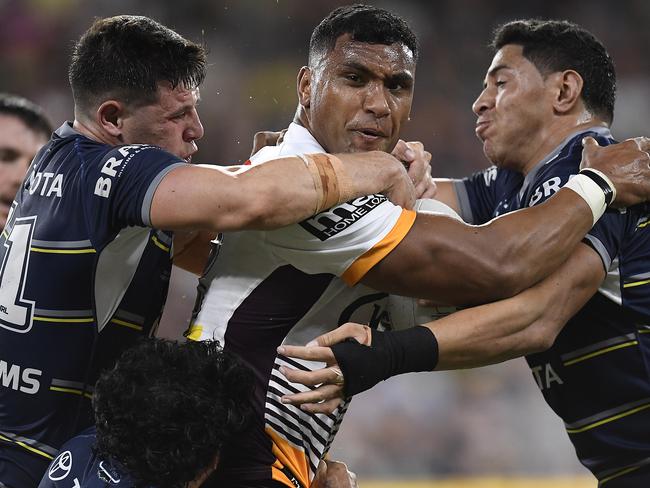 TOWNSVILLE, AUSTRALIA - MAY 08:  Tevita Pangai Junior of the Broncos is tackled by Shane Wright and Jason Taumalolo of the Cowboys during the round nine NRL match between the North Queensland Cowboys and the Brisbane Broncos at QCB Stadium, on May 08, 2021, in Townsville, Australia. (Photo by Ian Hitchcock/Getty Images)