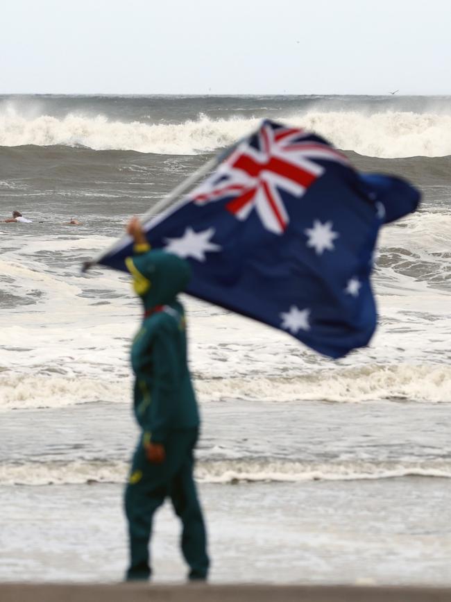 Fitzgibbons shows off her pride in the nation on the beaches of Tokyo. Picture: Getty Images