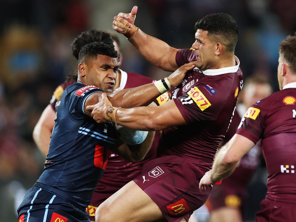 Tevita Pangai Junior fends away David Fifita. Picture: Getty Images