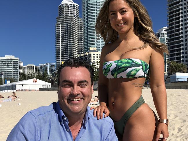 Member for Whitsunday Jason Costigan has courted controversy by posing with bikini-clad tourists.