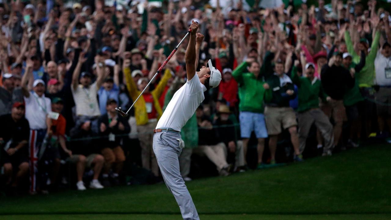 Adam Scott celebrates after making a birdie putt on the second playoff hole to win the Masters. (AP Photo/David J. Phillip, File)