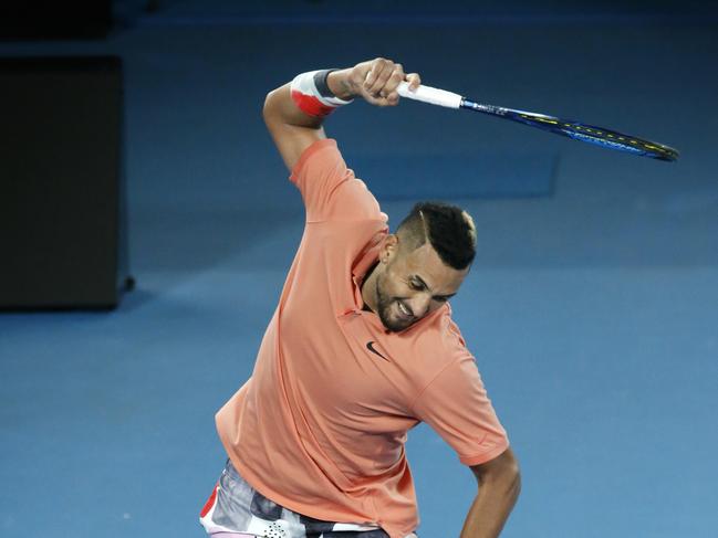 Nick Kyrgios takes out his frustration on his racquet during a match with Rafael Nadal on Rod Laver Arena. Picture: David Caird