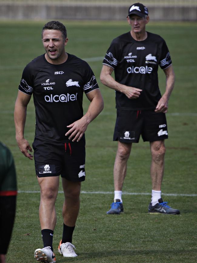 Sam Burgess (now coaching) under the watchful eye of head coach Wayne Bennett at South Sydney Rabbitohs training at Redfern Oval on Thursday. Picture: Adam Yip