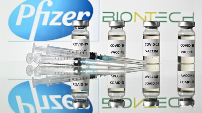 Vials with COVID-19 vaccine stickers attached and syringes with the logo of US pharmaceutical company Pfizer and German partner BioNTech. Picture: AFP