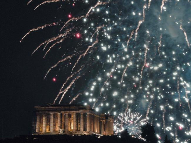 Fireworks explode over the Parthenon temple atop the Acropolis hill in Athens during New Year celebrations on January 1, 2019. Picture: AFP