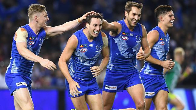 Sam Wright is congratulated after kicking a spectacular goal.