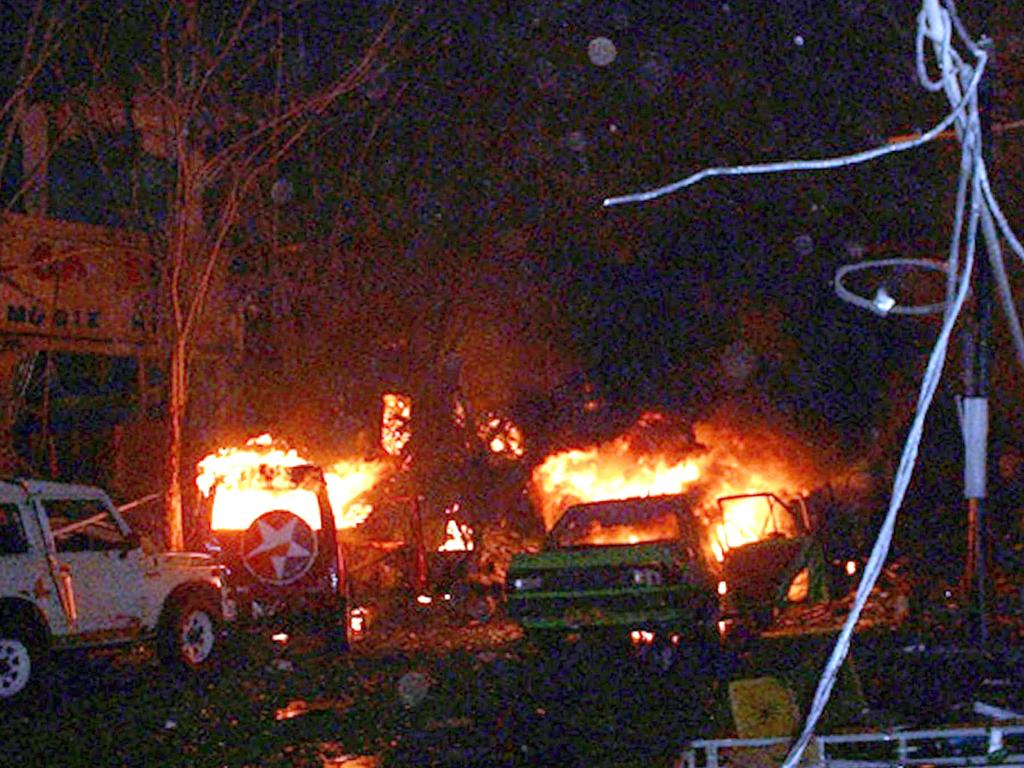 Buildings and cars burning after bomb blasts in the tourist area of Kuta, Bali, in 2002. Picture: AFP / Darma