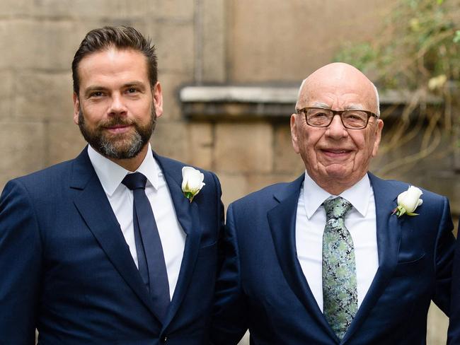 (FILES) Australian born media magnate Rupert Murdoch (C) flanked by his sons Lachlan (L) and James (R) arrive at St Bride's Church on Fleet Street in central London on March 5, 2016, to attend a ceremony of celebration a day after the official marriage of Rupert Murdoch and former US model Jerry Hall. Rupert Murdoch will step down as chairman of his global media empire, handing the post to son Lachlan, Fox Corp. and News Corp. announced Thursday. The Australian-born 92-year-old, who built a global entertainment and news juggernaut, will shift into an emeritus status at both companies in mid-November, the companies said. (Photo by Leon NEAL / AFP)