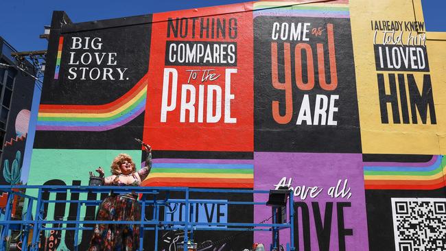 The official mural for Sydney WorldPride was unveiled on Redfern on Thursday. The 9m x 10m mural is a collage of quotes from personal love stories. Picture: Justin Lloyd