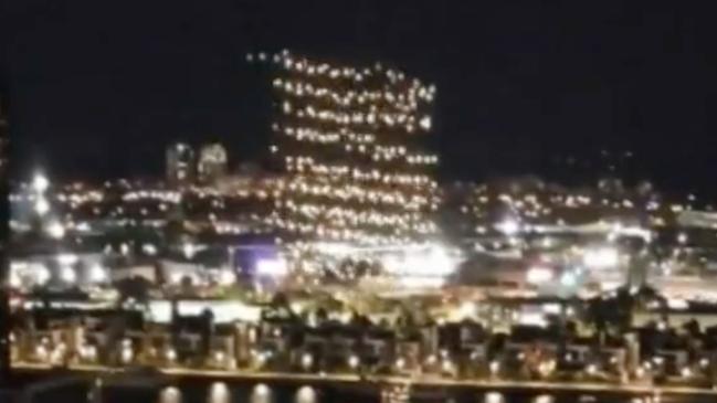 In videos posted to social media, drones were seen falling out of formation and into the Yarra River in Docklands on Friday night. Picture: Channel 9