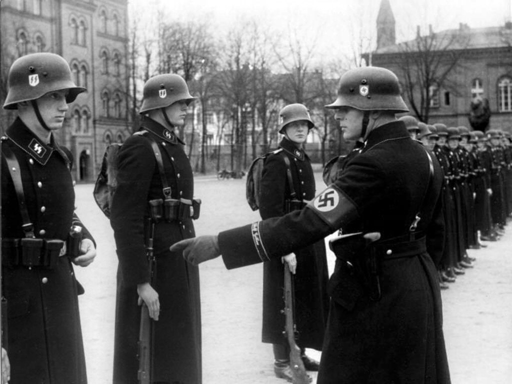 SS officers are believed to have used the palace in Poland as a brothel. Pictured in 1938 are members of the Leibstandarte SS Adolf Hitler.