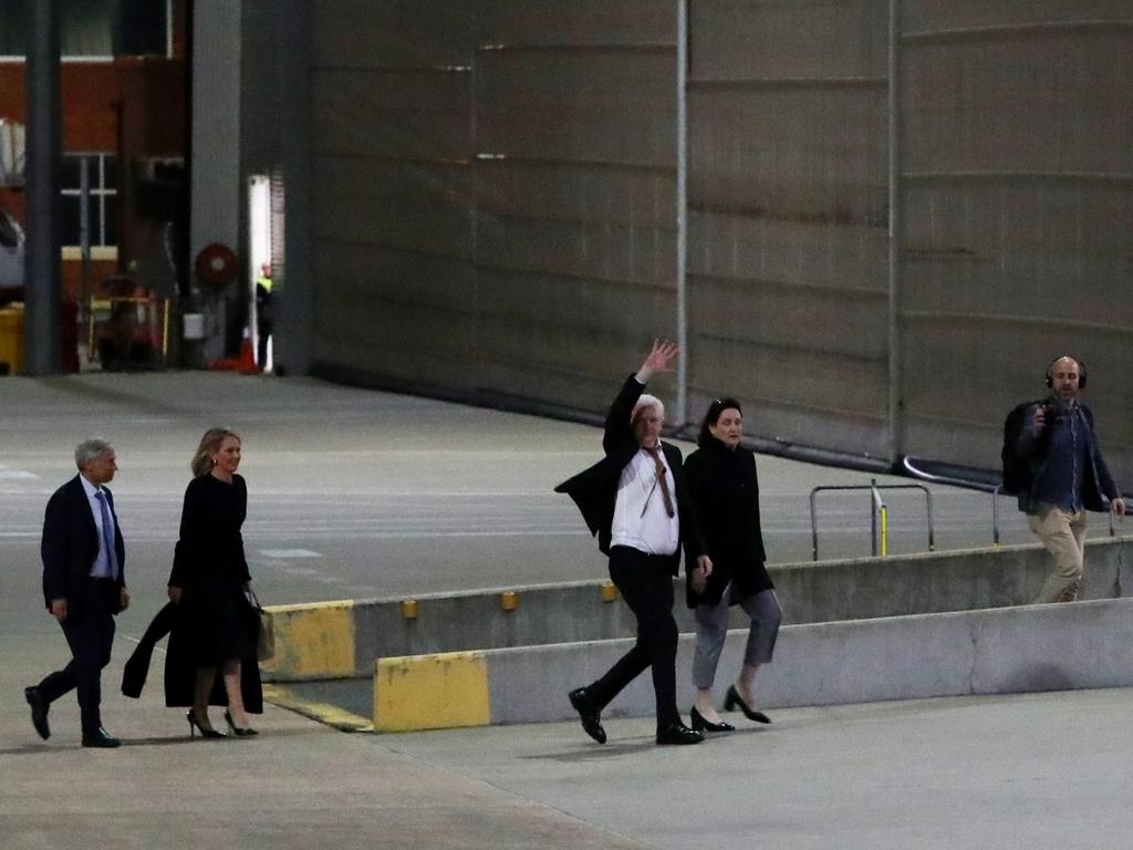 Julian Assange waves to supporters after arriving in Canberra. Picture: Getty Images