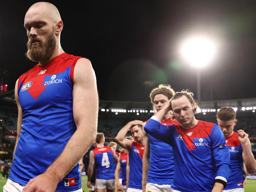 Injured Melbourne skipper Max Gawn leads his team off the MCG after losing to Collingwood. Picture: Michael Klein