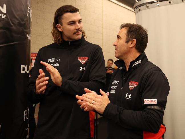 MELBOURNE, AUSTRALIA - MAY 11: Sam Draper and Brad Scott, Senior Coach of the Bombers are seen after the Bombers defeated the Giants during the round nine AFL match between Essendon Bombers and Greater Western Sydney Giants at Marvel Stadium, on May 11, 2024, in Melbourne, Australia. (Photo by Robert Cianflone/Getty Images)