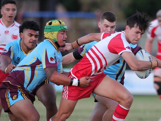 Keebra Park host Palm Beach Currumbin at Owen Park in the Langer Cup. Keebras Yorel Alapaki cant hang on to PBCs Ezra Ubaldino.  Picture Glenn Hampson