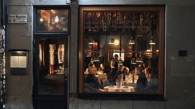 People sit in a restaurant in Stockholm, Sweden.