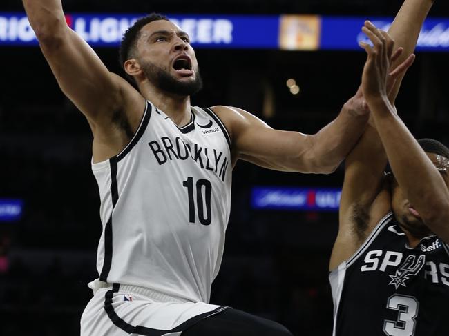 SAN ANTONIO, TX - JANUARY 17: Ben Simmons #10 of the Brooklyn Nets shots over Keldon Johnson #3 of the San Antonio Spurs  in the first half at AT&T Center on January 17, 2023 in San Antonio, Texas. NOTE TO USER: User expressly acknowledges and agrees that, by downloading and or using this photograph, User is consenting to terms and conditions of the Getty Images License Agreement. (Photo by Ronald Cortes/Getty Images)