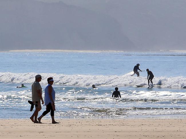 1/04/20 People ignore the closed beach signs at Point Roadknight beach near Anglesea. Aaron Francis/The Australian