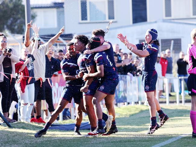 Ipswich SHS player Josiah Pahulu celebrates with teammates after a try. Picture: NIGEL HALLETT