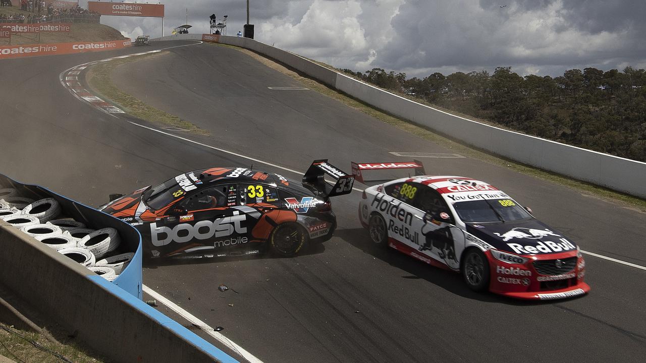 Richie Stanaway crashes as Jamie Whincup looks to avoid contact. Picture: Andy Pearson