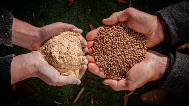 Phillipa and Skeet hold their export-quality red lentils and the gluten-free red lentil flour they mill on farm. Picture: Matt Turner.