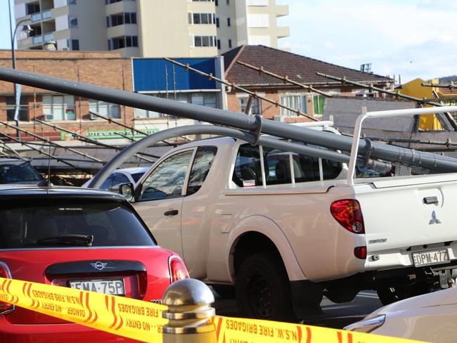 The driver of this ute is lucky to be alive, with a street light post crashing into the tray. Picture: Fiona Killman