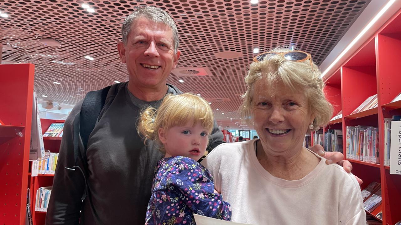 Peter and Merrian Penn with their granddaughter Heidi, 21 months, have immediately fallen in love with Parramatta's new library, Phive.